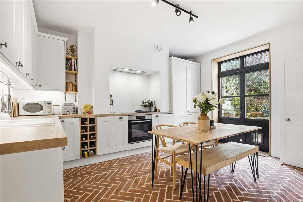 CHAIN FREE! A light-filled, generously sized and impeccably presented (approximately 573 Sq Ft/53 Sq M including an internally accessed storage area beneath the external stairs) patio garden maisonette full of charm and character, set in one of Kentish Town's most sought-after tree-lined roads. ...